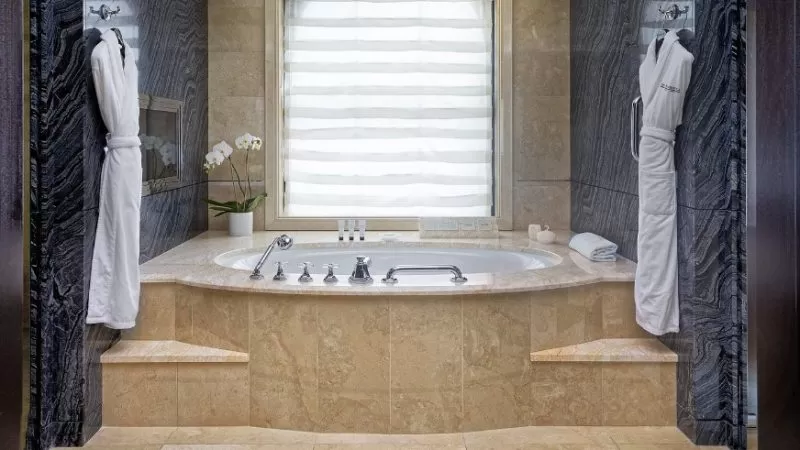 The Peninsula New York jacuzzi suite marble soaking tub Fifth Avenue